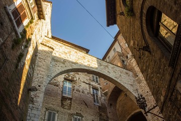 ancient historic arch between houses in the medieval part of Perugia city, Italy