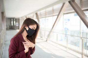 Asian woman wear face mask for protect COVID-19 virus,Thailand people,Young lady shortness of breath Coronavirus cough breathing problem