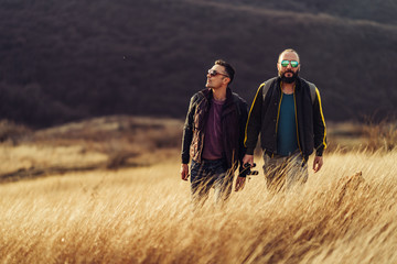 Tourists enjoy grassy rural hillside