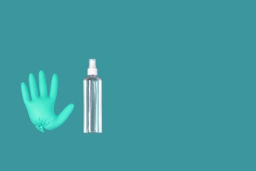 A medical glove and a a bottle of transparent sanitizer with outer place