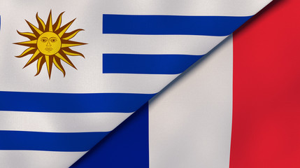 The flags of Uruguay and France. News, reportage, business background. 3d illustration
