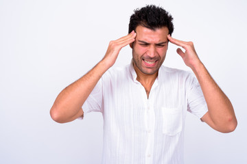 Portrait of stressed Turkish man having headache