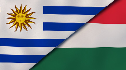 The flags of Uruguay and Hungary. News, reportage, business background. 3d illustration