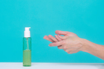 Woman using Alcohol Gel Hand Sanitizer. Pandemic protection, Hygienic and Health care concept