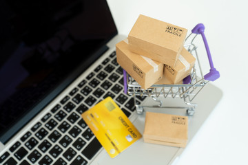 Online shopping or ecommmerce delivery service concept,Paper box on a laptop computer ,Easy shopping online concept