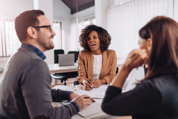 Three business colleagues discussing at the meeting