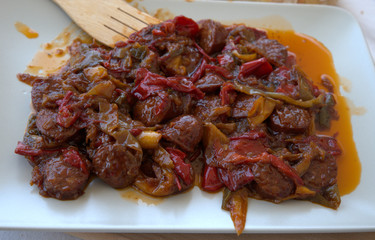 Sausage and peppers, cooked in the pan, traditional Greek food