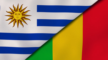 Fototapeta premium The flags of Uruguay and Mali. News, reportage, business background. 3d illustration