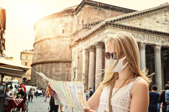 tourist visits the map with a rome and a pantheon in a mask