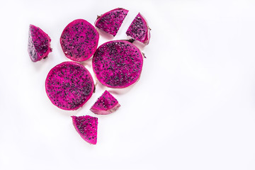slices of red dragon fruit on a white background, healthy Asian fruit