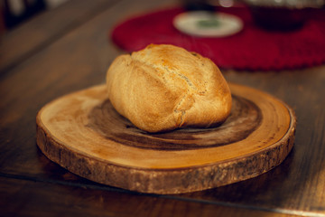 Breakfast table wood with coffee cups and hot bread.