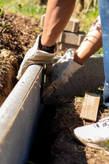 Worker putting curbs
