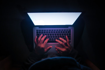 Close up of hacker hand stealing data 