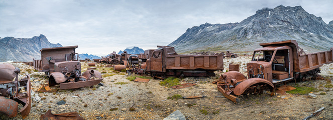 Panoramic view of a Military truck graveyard in Greenland