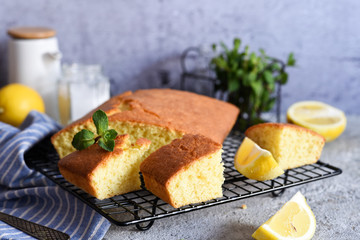 Lemon cake with zest on a concrete background. View from above.