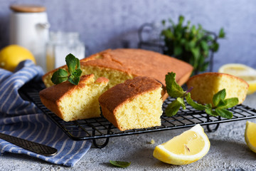 Lemon cake with zest on a concrete background. View from above.