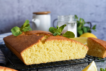 Lemon cake with zest on a concrete background. View from above.