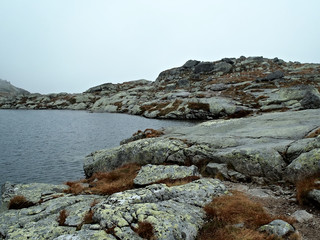 stony shore of a mountain lake