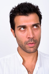 Obraz premium Face of handsome Turkish man thinking and looking up