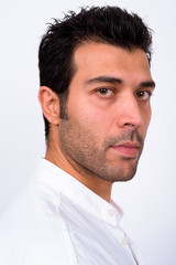 Obraz premium Closeup profile view of handsome Turkish man looking at camera