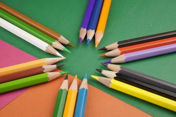 multicolored pencils on a colored background