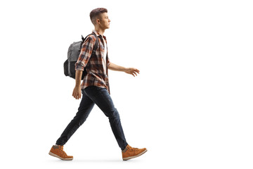 Male student with a backpack walking - obrazy, fototapety, plakaty