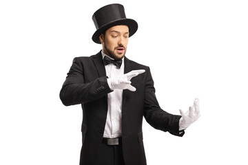 Magician wearing white gloves and performing a trick with his hands