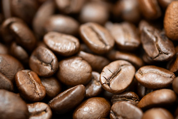 Closeup view of brown roasted coffee beans, can be use as background, copy space for text.