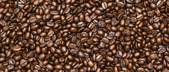 Top view of brown roasted coffee beans, can be use as background, copy space for text.