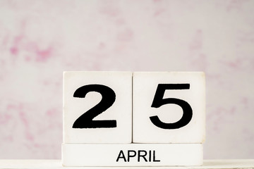 White cube calendar for April with copy space