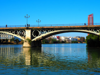 Fototapeta na wymiar View of the Isabel II Bridge (popularly called Puente de Triana) in Seville, Spain.