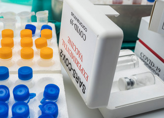 Coronacirus covid-19 experimental vaccine in a laboratory, conceptual image