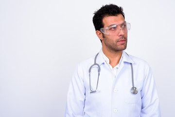 Fototapeta premium Handsome Turkish man doctor wearing protective glasses against white background
