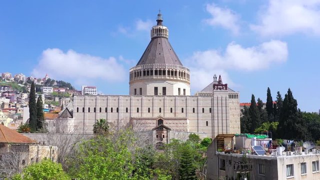 Aerial footage of the Basilica of the Annunciation over the old city houses of Nazareth 