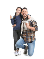 Father with daughter drinking milk on white background