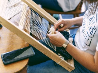 close up of a girl weaving
