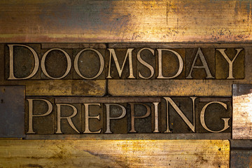 Photo of real authentic typeset letters forming Doomsday Prepping text on vintage textured grunge copper background