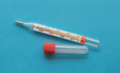 thermometer and test tube on a blue background