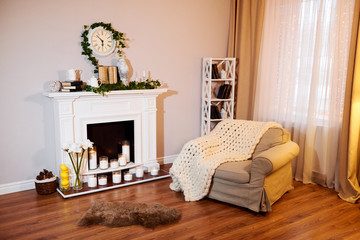 Classic white interior of living room with sofa near fireplace
