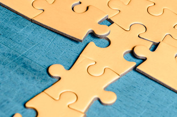 the unexpected solution.
yellow puzzle with a row in wrong position, on a blue background, symbol...