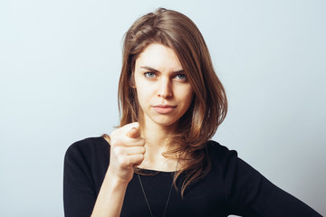 attractive woman showing fig gesture isolated