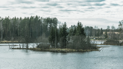 Island in the middle of lake. Film effect photo