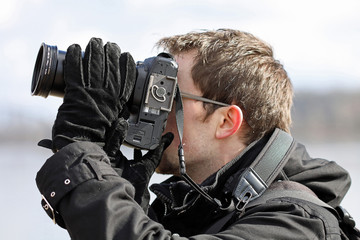 Photographer capturing picture during winter time