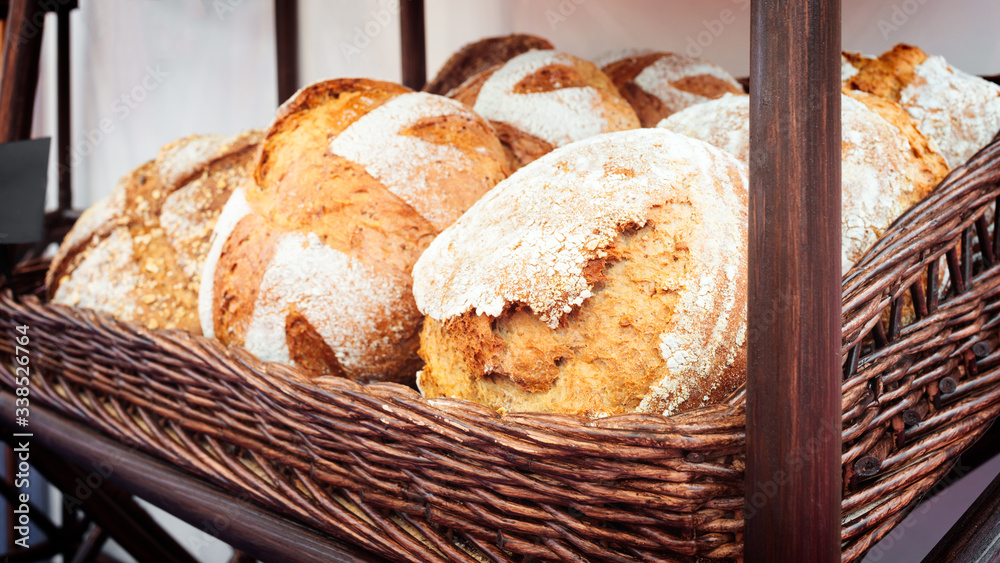 Poster fresh breads on the shelf in the bakery