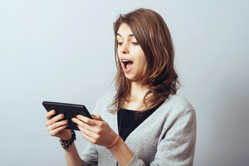 Naklejka premium young woman using digital tablet computer