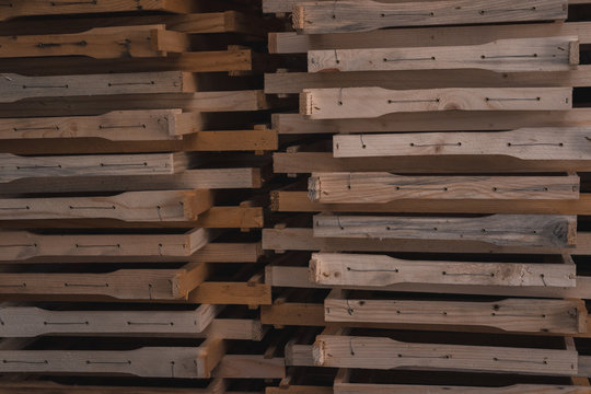 frames for bee hives, wooden items for beekeeping, wooden frames are stacked, a lot