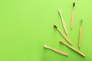 Tooth brushes on color background