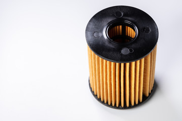 The filter element of a new oil filter. New spare parts for an internal combustion engine. Filter insert