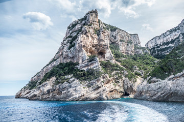 Fototapeta premium Natural caves in gulf of Orosei with turquoise water