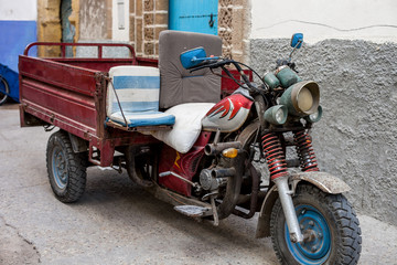 an old motorcycle with a trailer